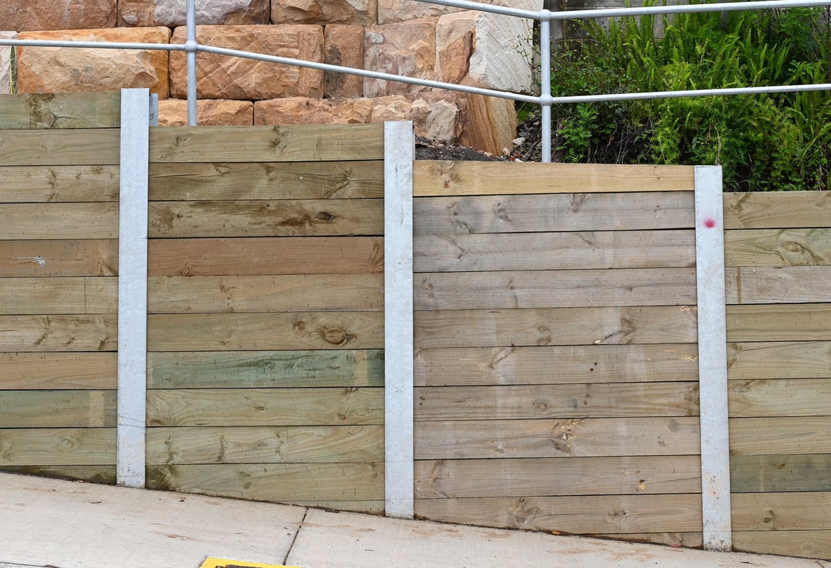 Treated pine sleeper and steel retaining wall