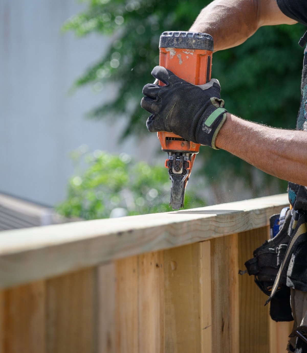 Professional fence repair with nail gun tool